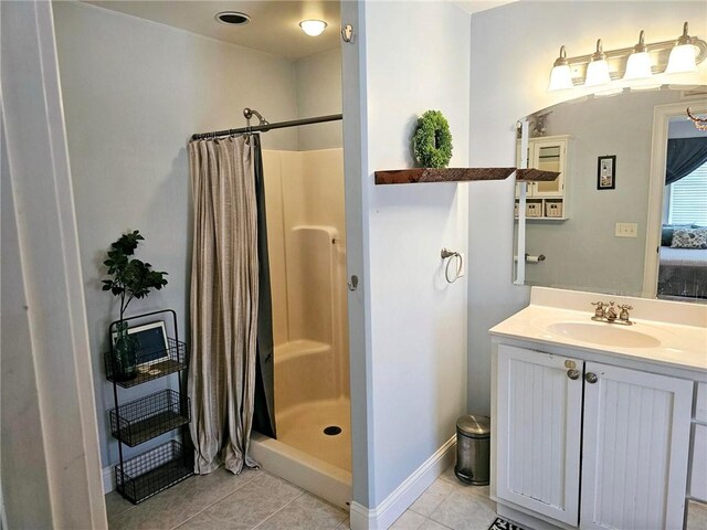 bathroom featuring vanity, walk in shower, and tile patterned floors