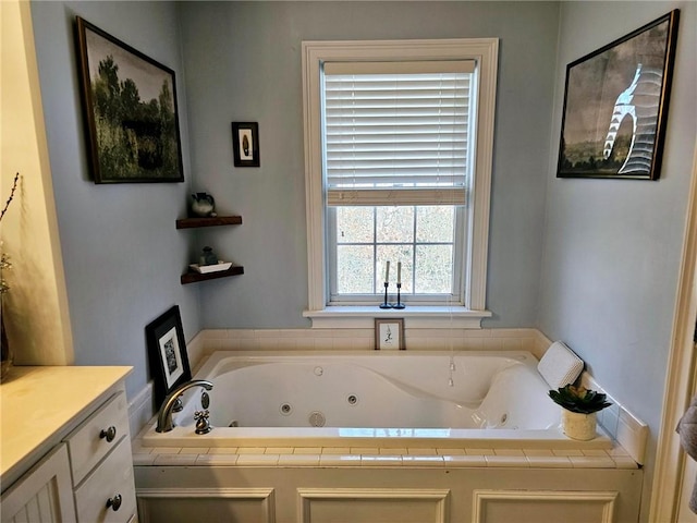 bathroom with a tub to relax in and vanity