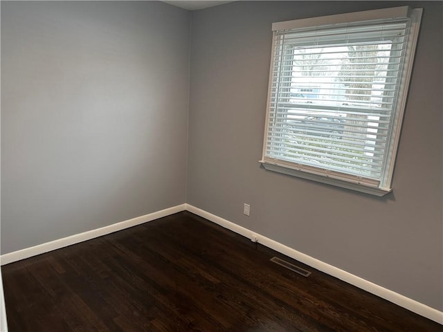 unfurnished room featuring wood-type flooring