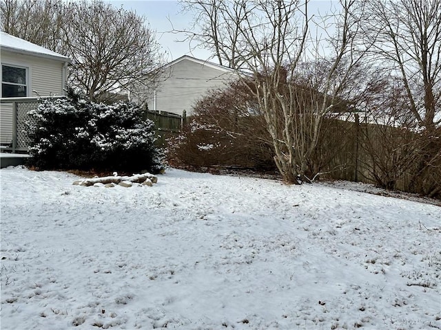 view of yard layered in snow