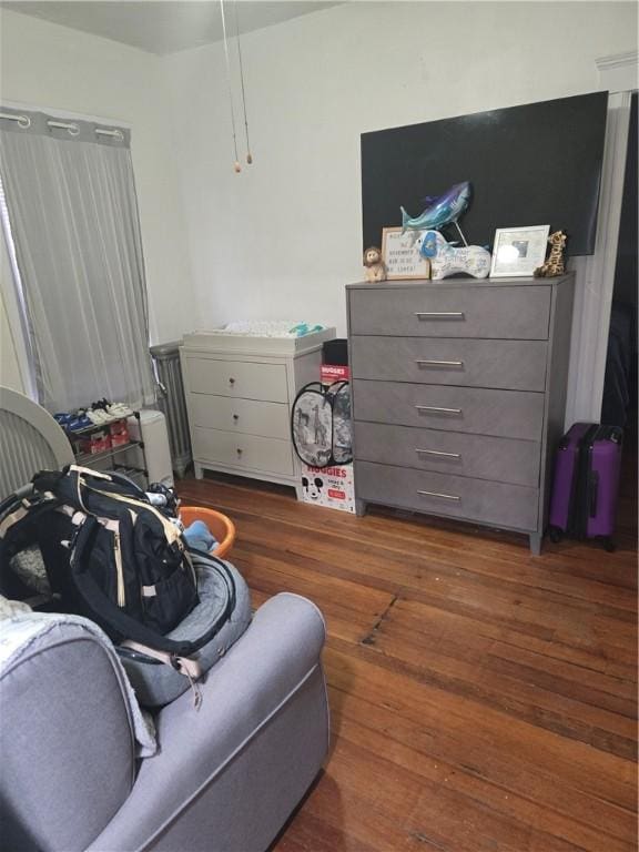 bedroom featuring dark hardwood / wood-style flooring