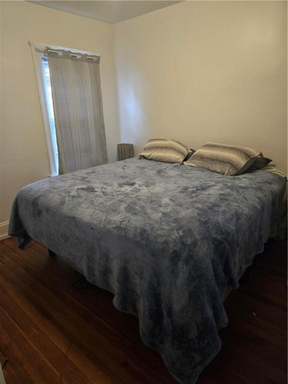 bedroom featuring dark wood-type flooring