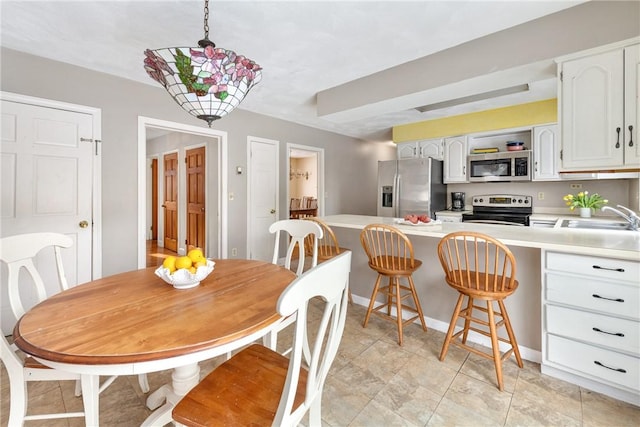 dining area featuring sink