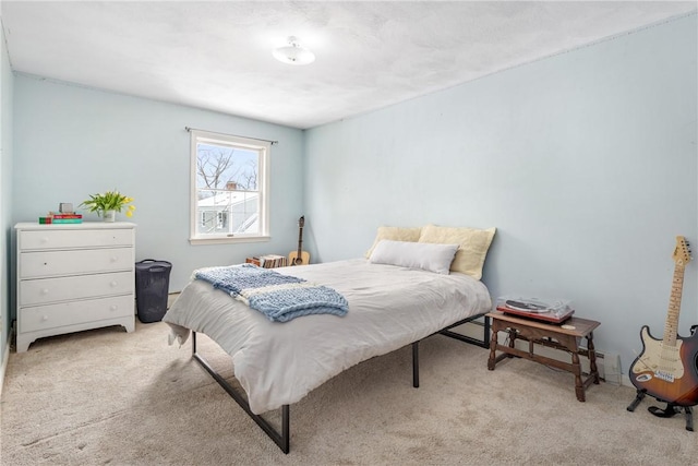 bedroom with light colored carpet