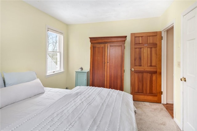 bedroom featuring light carpet