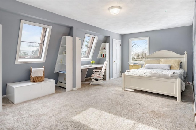 carpeted bedroom with a baseboard heating unit