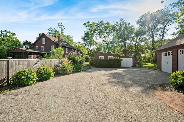 view of yard with a garage and an outdoor structure