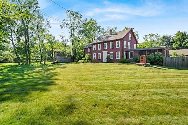 view of yard featuring a sunroom