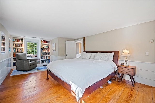 bedroom with light hardwood / wood-style flooring