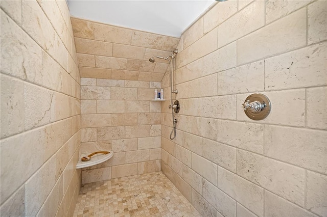 bathroom featuring tiled shower