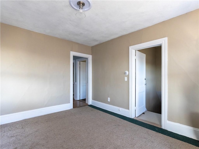 unfurnished bedroom featuring dark carpet