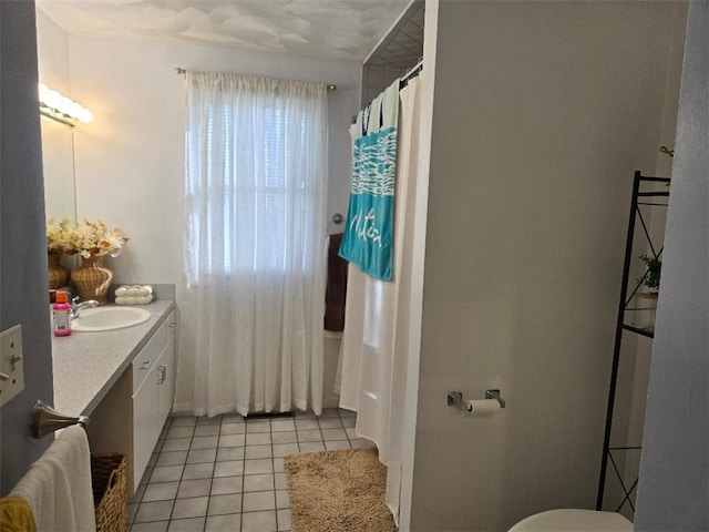 bathroom featuring tile patterned floors and vanity