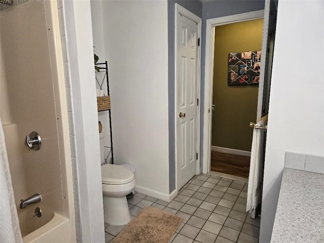 full bathroom featuring toilet, vanity, shower / washtub combination, and tile patterned flooring