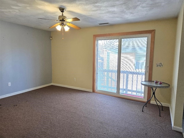 empty room with ceiling fan and carpet