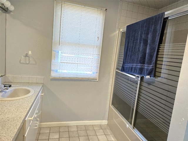 bathroom featuring shower / bath combination with glass door, tile patterned floors, and vanity