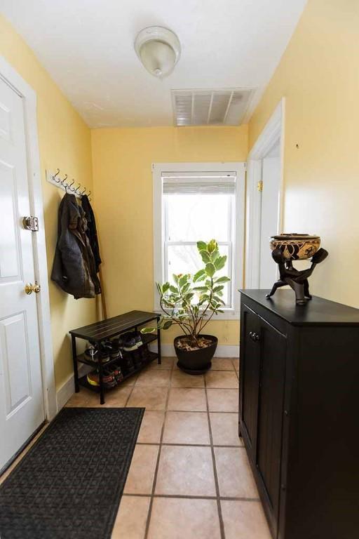 mudroom with light tile patterned flooring