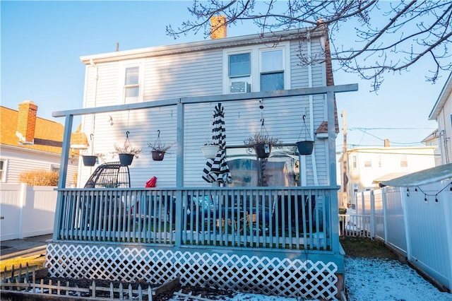 rear view of house with a deck