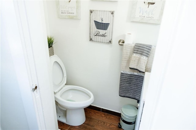 bathroom with wood-type flooring and toilet