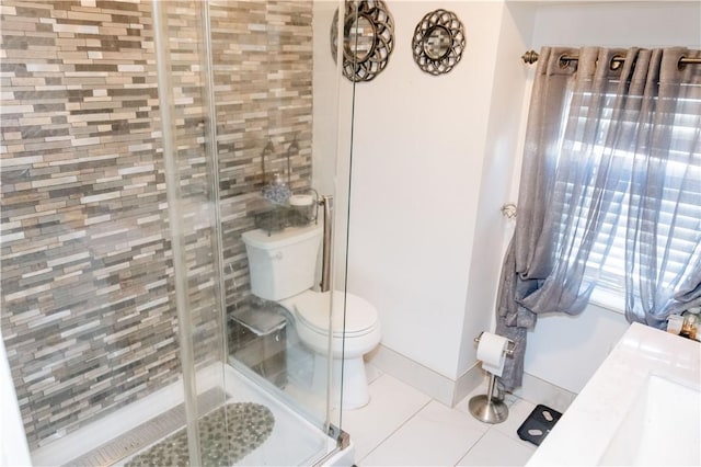 bathroom with toilet, tile patterned flooring, and walk in shower