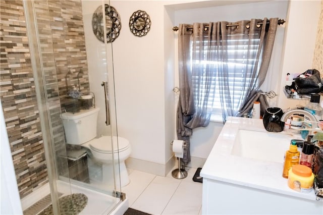 bathroom with vanity, toilet, a shower with shower door, and tile patterned flooring