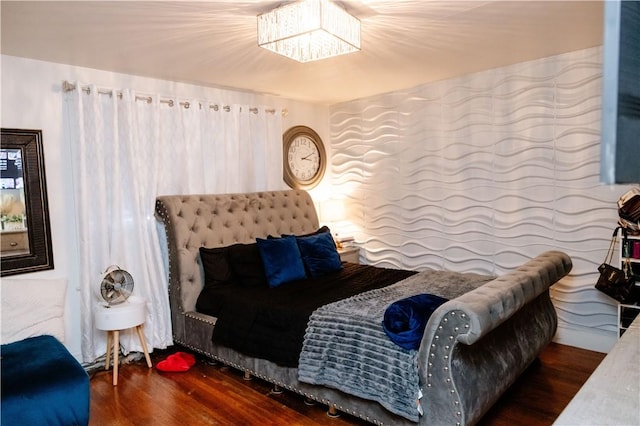 bedroom with dark wood-type flooring