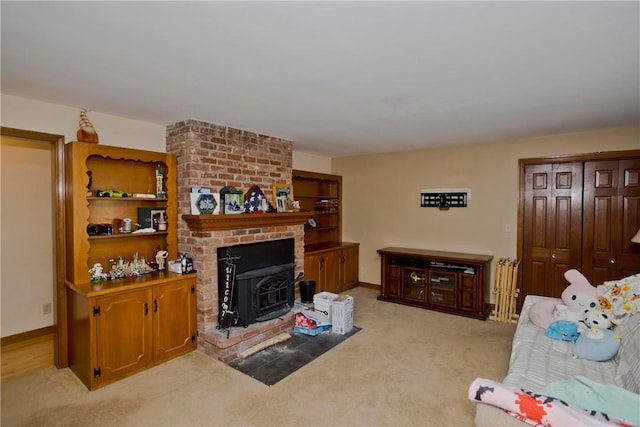 carpeted living room with a wood stove