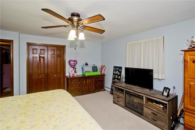 bedroom featuring a closet, ceiling fan, and carpet flooring