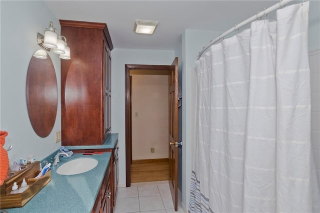 bathroom with tile patterned floors and vanity