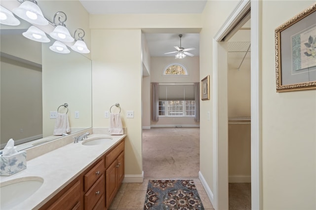 bathroom with vanity, ceiling fan with notable chandelier, and tile patterned flooring