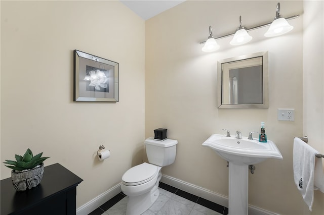 bathroom featuring tile patterned floors and toilet