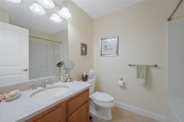 bathroom featuring toilet, a shower, tile patterned flooring, and vanity