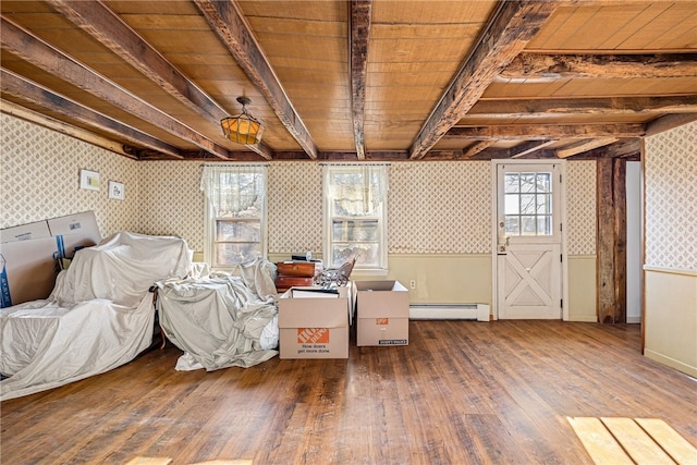 interior space with hardwood / wood-style flooring and a baseboard heating unit