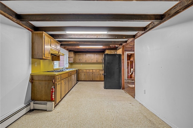 kitchen with baseboard heating, black refrigerator, sink, light colored carpet, and beamed ceiling