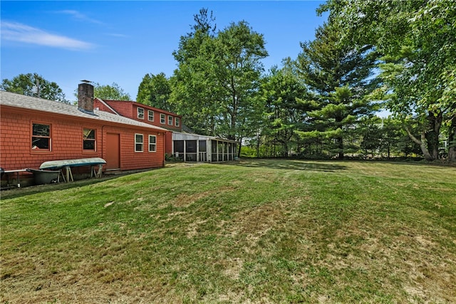 view of yard with a sunroom