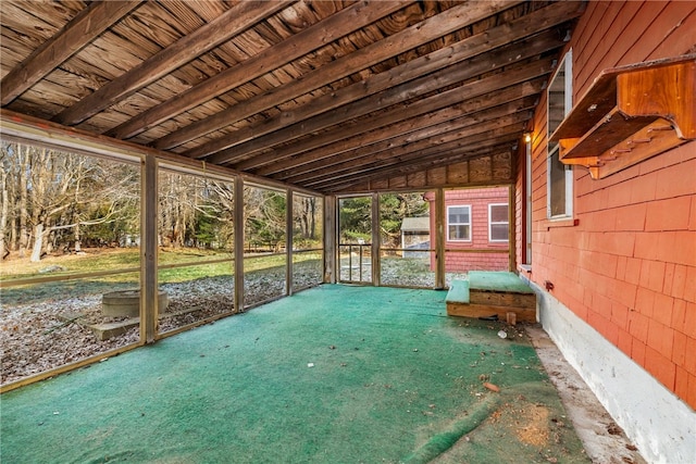 unfurnished sunroom with wood ceiling