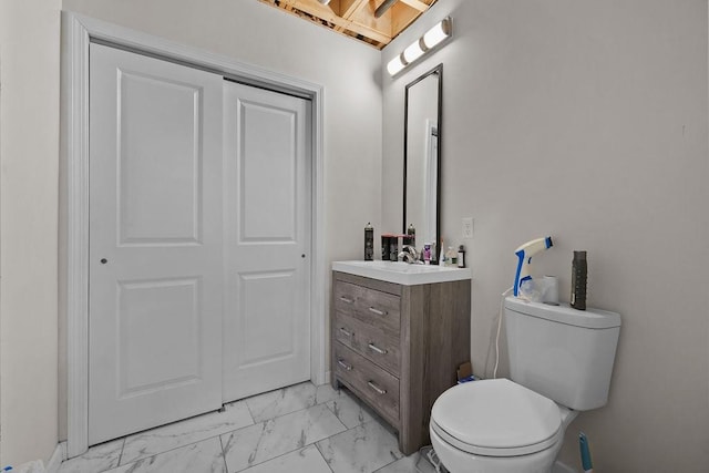 bathroom with toilet and vanity