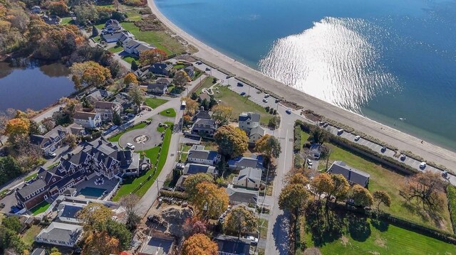 drone / aerial view with a residential view and a water view