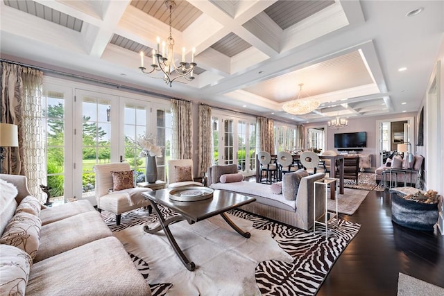 living room featuring a healthy amount of sunlight, an inviting chandelier, and french doors