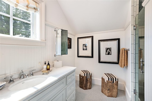 bathroom featuring an enclosed shower, vanity, tile patterned flooring, and vaulted ceiling