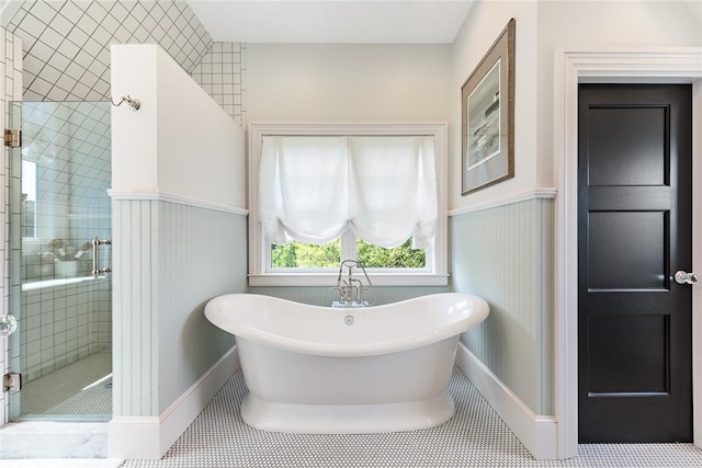 bathroom featuring tile patterned flooring and separate shower and tub