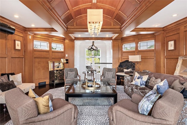 living room with coffered ceiling, a notable chandelier, beam ceiling, and wood walls