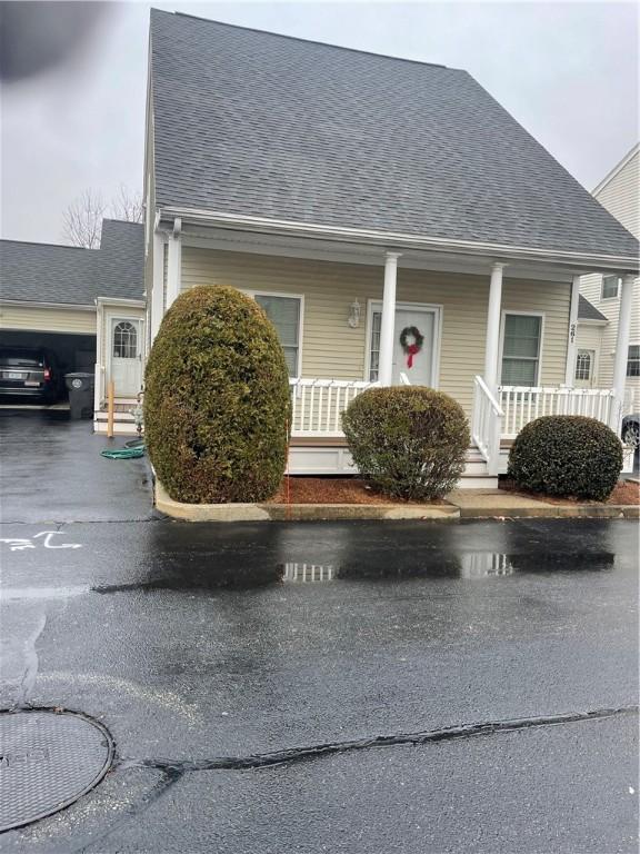 view of front of home featuring a garage and a porch