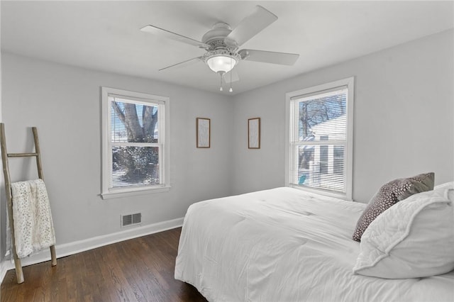 bedroom featuring dark hardwood / wood-style floors and ceiling fan