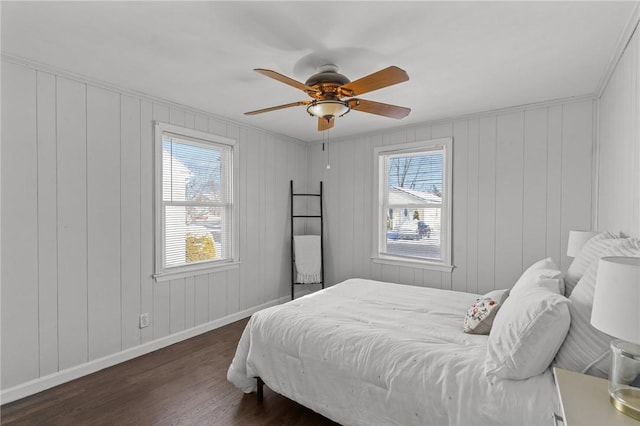 bedroom featuring dark wood-type flooring and ceiling fan