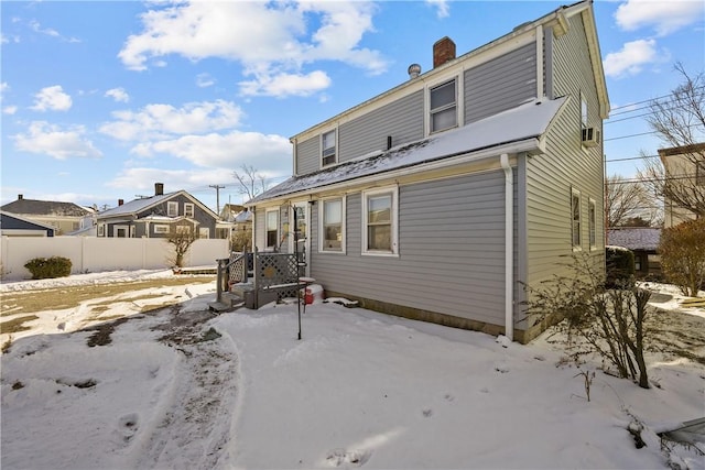 view of snow covered house