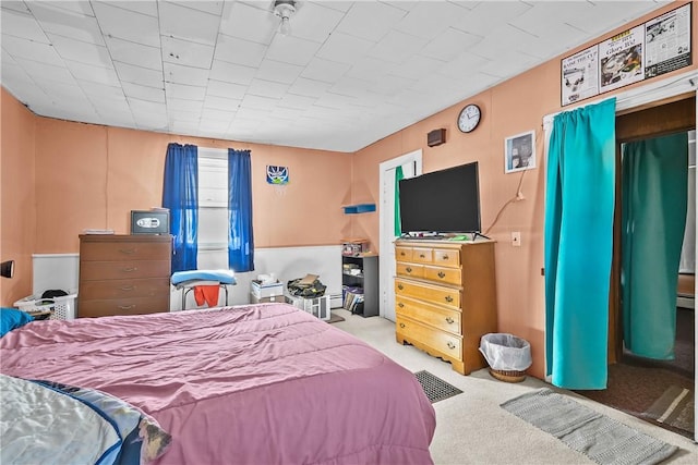 bedroom featuring light colored carpet