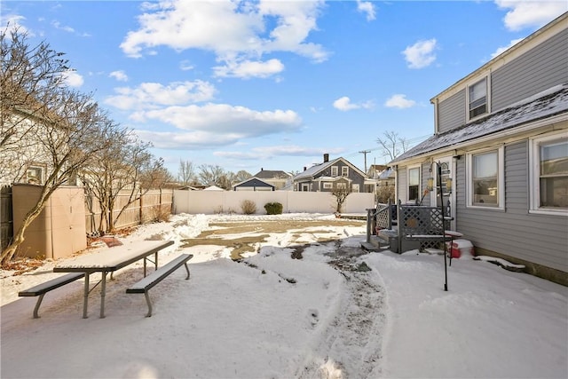 view of yard layered in snow