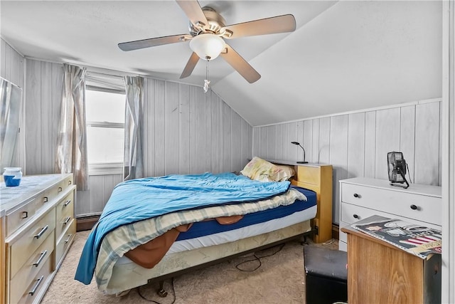 carpeted bedroom with ceiling fan, lofted ceiling, a baseboard radiator, and wood walls