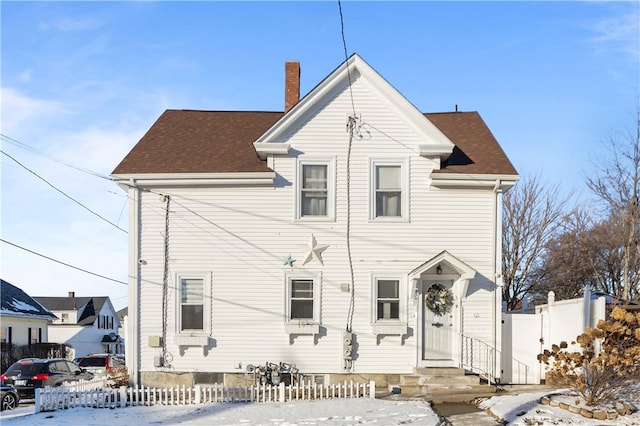 view of snow covered house