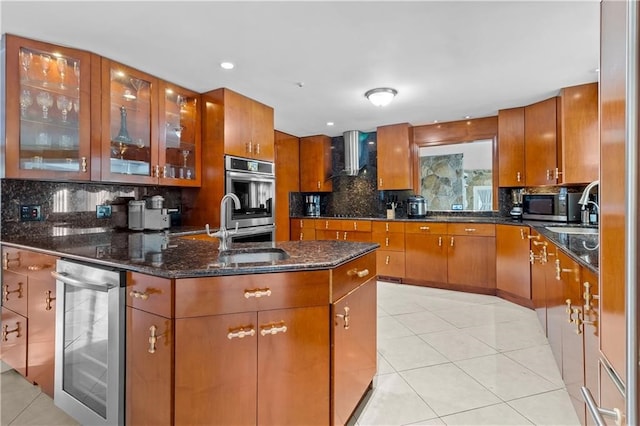 kitchen featuring appliances with stainless steel finishes, sink, dark stone countertops, wine cooler, and light tile patterned floors